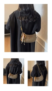 Brown faux shearling croissant bag with colorful wooden bead tassel and knotted strap detail