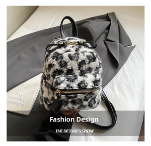 Detail shot of mini leopard print backpack with faux fur texture and gold hardware