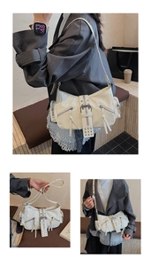 Detailed view of cream Y2K motorcycle bag with decorative zippers and long tassels