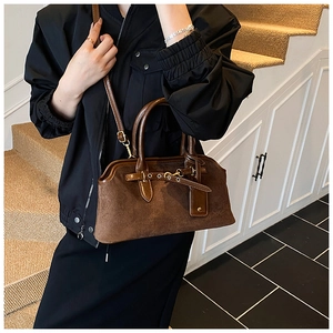 Brown frosted leather vintage handbag with adjustable shoulder strap and metal buckle detail