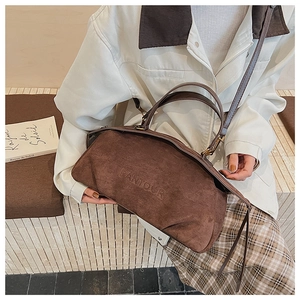 Detail of the PANTOOR vintage coffee suede shoulder bag with a soft tactile texture