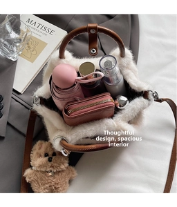 Spacious white plush bucket bag interior showing storage for umbrella and wallet