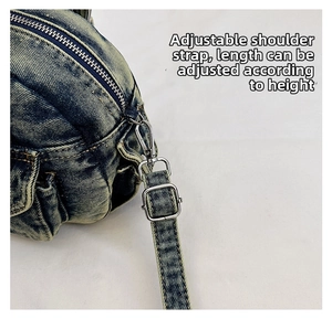 Detail of adjustable denim shoulder strap with silver buckle for height customization