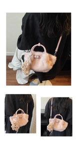 Detail of pink faux fur bucket bag with plush bear charm and leather handles