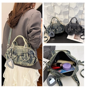 Detailed interior view of a washed denim crossbody bag showing its large storage capacity
