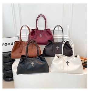 Collection of large leather tote bags with cross pendants in multiple autumn colors
