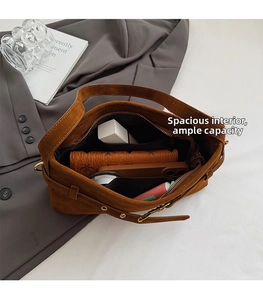Top view of brown suede handbag interior showing spacious capacity for phone and wallet