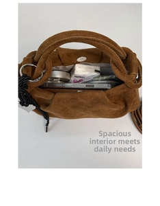 Detailed interior of brown suede tote bag showing large capacity for daily essentials