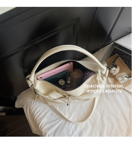 Interior view of white pebble leather tote bag showing large capacity for essentials