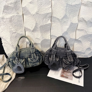 Retro denim baguette handbag in blue and grey with outer pockets and heart mirror charm
