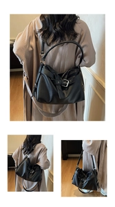 Detail view of black pebble leather tote bag with metal buckle and adjustable strap