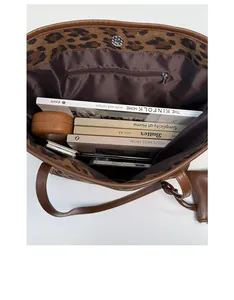 Spacious interior of leopard print tote bag showing storage capacity and inner pocket