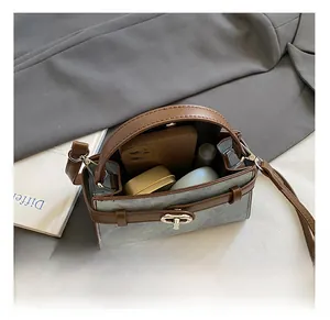 Interior view of the blue and brown crossbody bag showing capacity for daily essentials