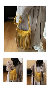 Detail of bohemian mustard yellow suede crossbody bag with long fringe and zip closure
