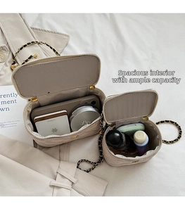 Internal view showing ample storage capacity of quilted denim vanity chain bags