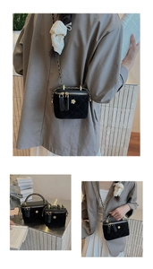 Close-up of quilted black velvet crossbody bags with gold floral clasps and chain straps