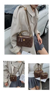 Close-up of quilted suede crossbody bags in two sizes with gold floral hardware and chain