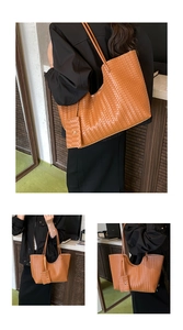 Detail of woven brown tote bag featuring a matching detachable zipper coin purse attachment