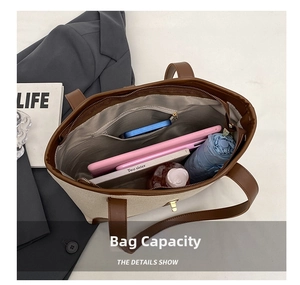 Top view of spacious beige canvas tote bag interior with multiple compartments and essentials