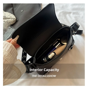 Interior view of black motorcycle style underarm bag showing spacious storage capacity