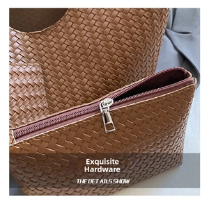 Detailed macro shot of silver hardware zipper and premium brown woven texture