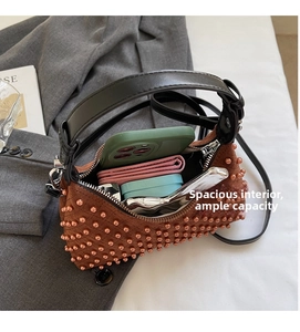 Internal view showing large capacity of the brown studded suede tote with wide handle