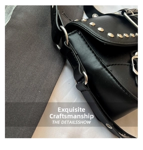 Close-up of black PU leather shoulder bag with silver rivets and metal buckle detail