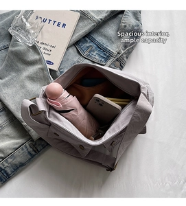 Top view of spacious lavender nylon shoulder bag showing interior storage for daily items