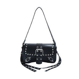 Black leather punk shoulder bag with silver rivets and metal buckle in studio shot
