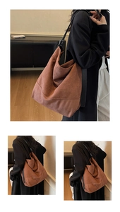Détail du grand sac hobo marron avec coutures vintage et bandoulière en cuir