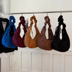 Minimalist suede hobo bags in assorted colors with gathered shoulder straps and side ties