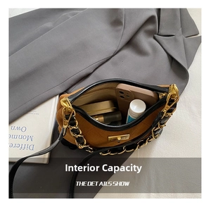 Interior view of brown quilted suede bag showing storage for phone and cosmetics