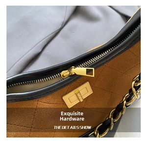 Detail of vintage matte chain bag featuring rhombus quilting and gold-tone hardware