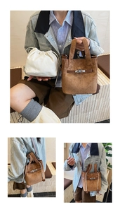 Retro brown suede bucket bag with metal lock detail and white drawstring inner pouch
