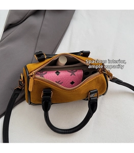 Top view of spacious mustard yellow Boston bag showing interior storage capacity