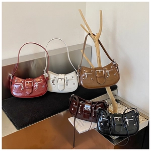 Detailed row of five Y2K style rivet bags in multiple colors with glossy finish