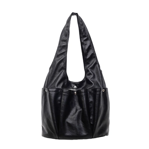 Minimalist black PU leather tote bag with functional pockets and metal rivet details