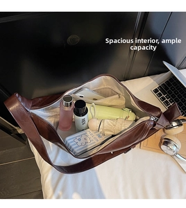 Deep brown leather tote bag interior view showing large capacity and internal pockets