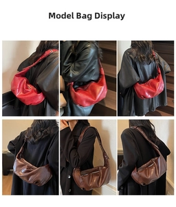 Detail of crescent hobo bag with pleated texture and adjustable strap in red and brown