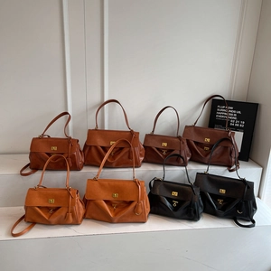 Minimalist leather tote bags in multiple colors and sizes with gold rotary buckles
