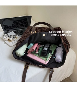 Detailed top view of a leopard print tote bag interior showing its spacious storage capacity
