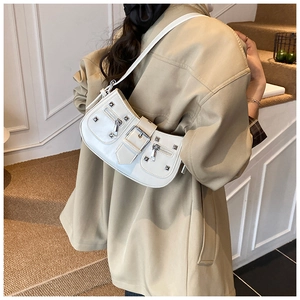 Detailed back view of white rivet shoulder bag with silver hardware and Y2K aesthetic