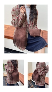 Close-up of retro brown suede bucket bag with long tassels and matching small pouch