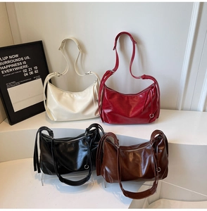 Group display of high-quality faux leather tote bags in beige, red, black, and coffee colors
