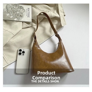 Detailed view of the brown retro hobo bag with sleek leather finish and metallic zipper