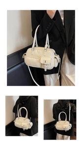 Detailansicht der cremeweißen Bowlingtasche mit Multi-Pocket-Design und Silberbeschlägen