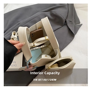 Detail view of women's PU leather bucket bag with inner pouch, stylish autumn shoulder handbag.