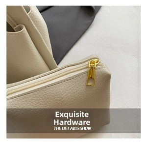 Close-up detail of women's PU leather bucket bag with gold zipper texture in autumn style.