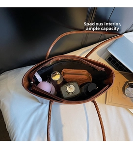 Detailed top view of a dark brown bucket bag interior showing spacious capacity and pockets