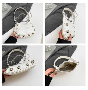 Detailed views of a white leather crescent bag with silver rivets and metal chain strap